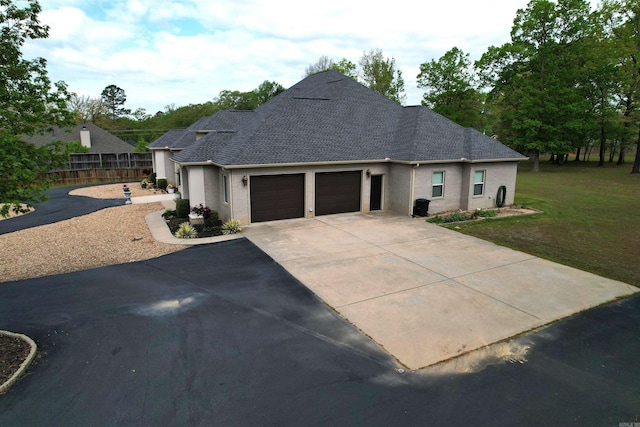 2780 Shoemaker Rd, Sheridan, AR 72150 - single story home featuring roof with shingles, driveway, fence, an attached garage, and a front yard