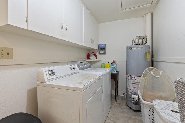 7803 Ascension Rd, Little Rock, AR 72204 - washroom featuring water heater, washing machine and clothes dryer, and cabinet space
