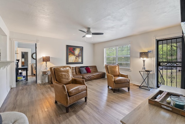 7803 Ascension Rd, Little Rock, AR 72204 - living area with wood finished floors, a ceiling fan, and baseboards