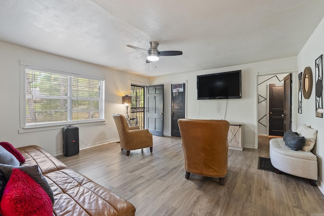 7803 Ascension Rd, Little Rock, AR 72204 - living area with wood finished floors, baseboards, and ceiling fan