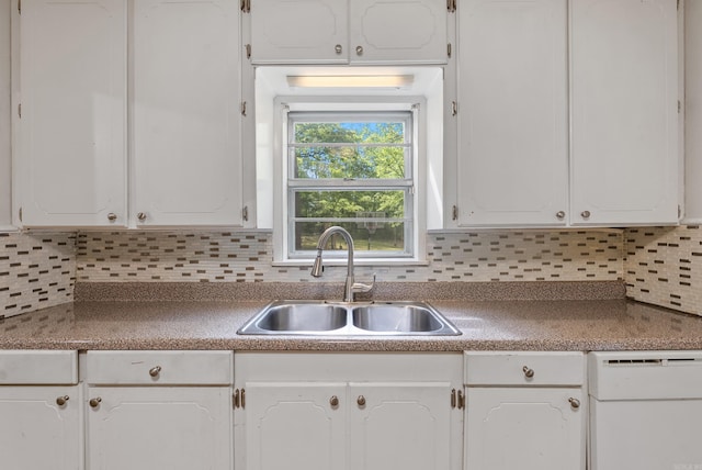7803 Ascension Rd, Little Rock, AR 72204 - kitchen with dishwasher, decorative backsplash, white cabinetry, and a sink