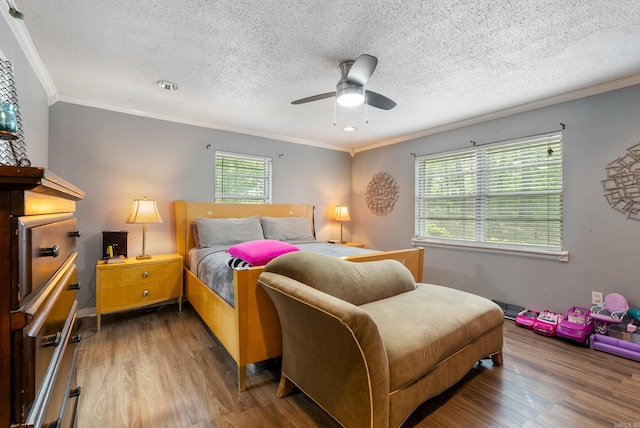 7803 Ascension Rd, Little Rock, AR 72204 - bedroom with wood finished floors, a textured ceiling, a ceiling fan, and ornamental molding