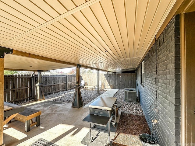 view of patio / terrace featuring central AC and a fenced backyard