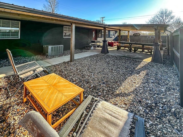 view of yard with cooling unit, a patio area, and a fenced backyard