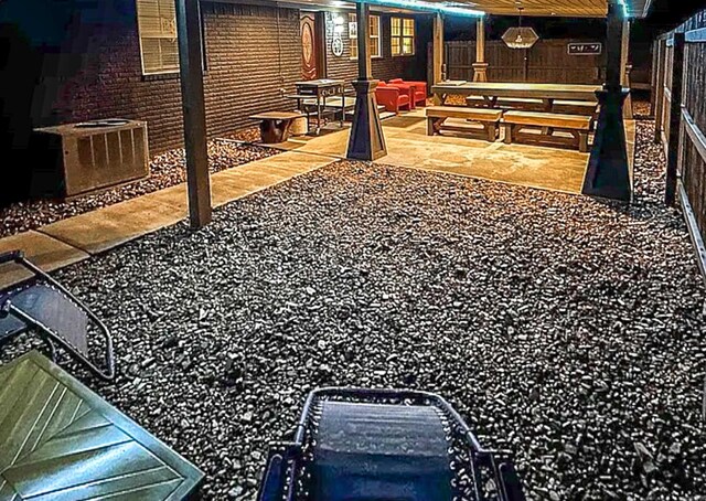 view of yard featuring central AC, fence, and a patio area