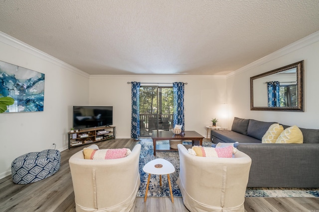 living room with crown molding, wood finished floors, and a textured ceiling