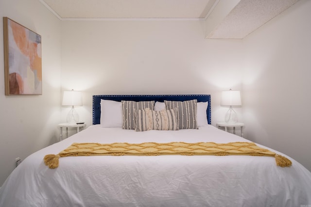 bedroom with ornamental molding