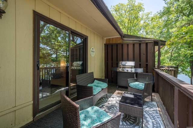 view of wooden balcony with a wooden deck and a grill