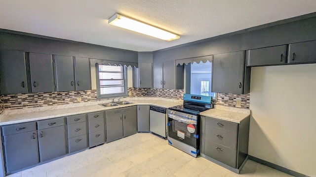 kitchen with backsplash, stainless steel appliances, and plenty of natural light