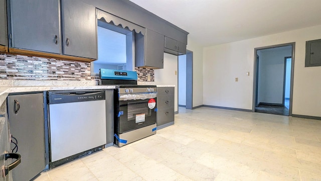 kitchen with electric panel, decorative backsplash, light countertops, and appliances with stainless steel finishes