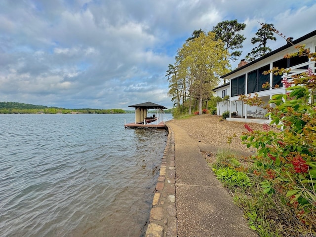 water view featuring boat lift and a boat dock