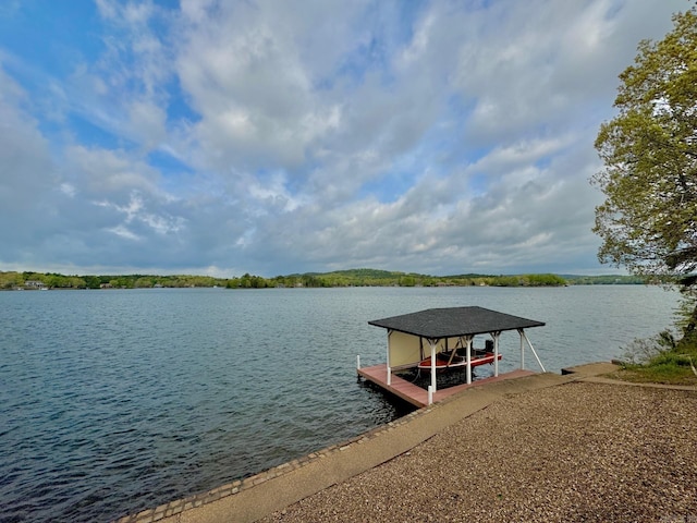 view of dock featuring boat lift and a water view