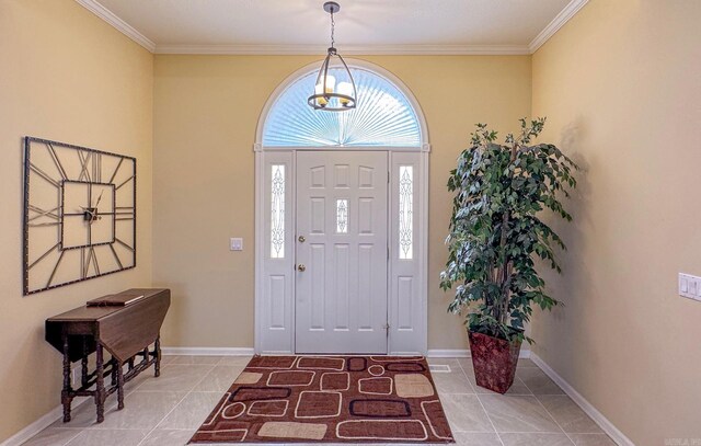 foyer entrance with baseboards, ornamental molding, and light tile patterned floors