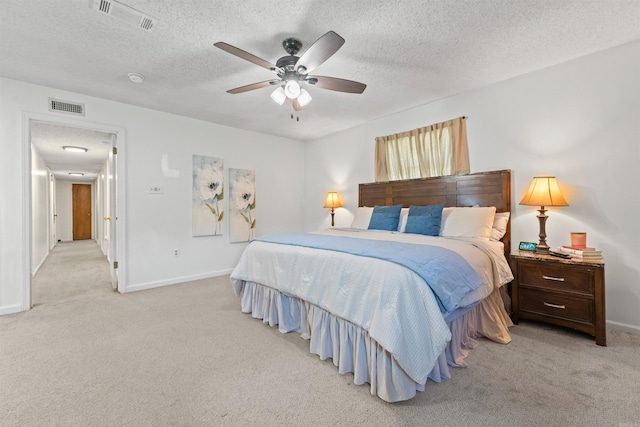 111 Pamela Ln, Sherwood, AR 72120 - bedroom featuring baseboards, visible vents, a textured ceiling, and light colored carpet