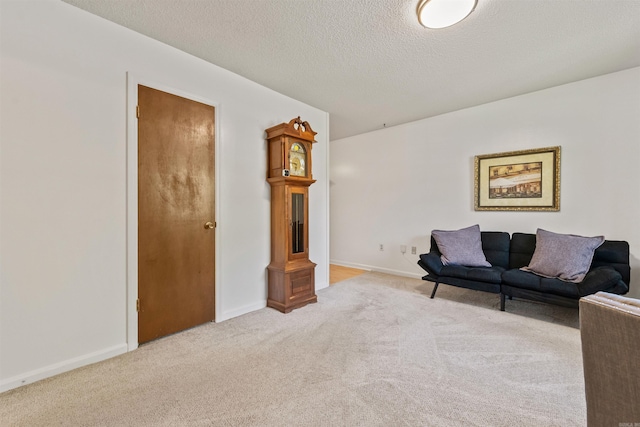 111 Pamela Ln, Sherwood, AR 72120 - carpeted living room featuring baseboards and a textured ceiling
