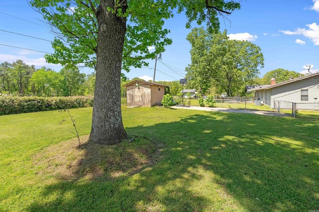 111 Pamela Ln, Sherwood, AR 72120 - view of yard featuring an outdoor structure, fence, and a storage unit