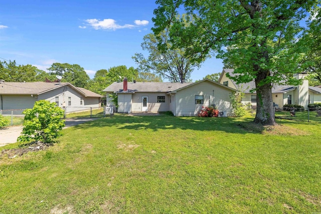 111 Pamela Ln, Sherwood, AR 72120 - back of house featuring fence, a lawn, and a chimney