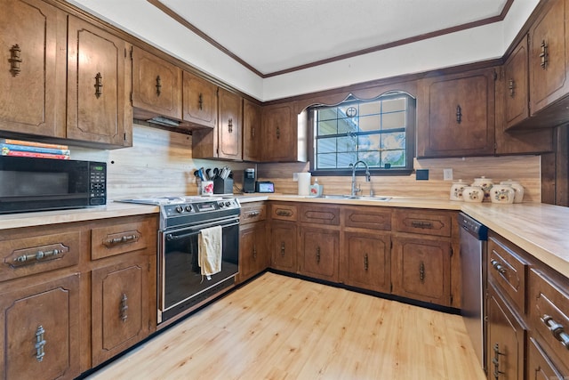 111 Pamela Ln, Sherwood, AR 72120 - kitchen featuring black microwave, electric range, light wood finished floors, and stainless steel dishwasher