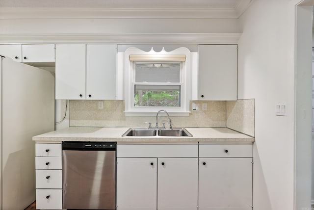 kitchen with a sink, white cabinetry, decorative backsplash, light countertops, and appliances with stainless steel finishes