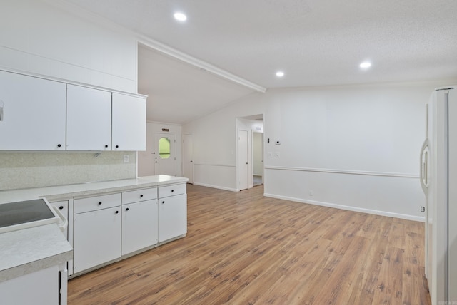 kitchen featuring white cabinets, light wood-style floors, white appliances, and light countertops