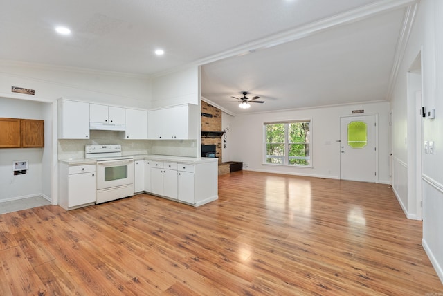 kitchen featuring under cabinet range hood, white range with electric stovetop, light countertops, a ceiling fan, and crown molding