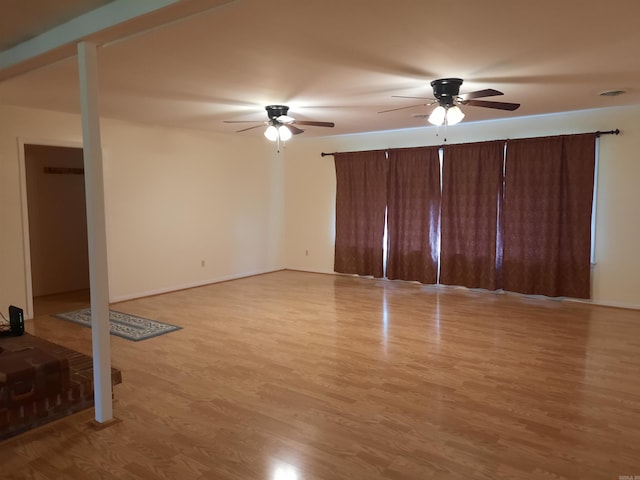 unfurnished living room with light wood finished floors and a ceiling fan