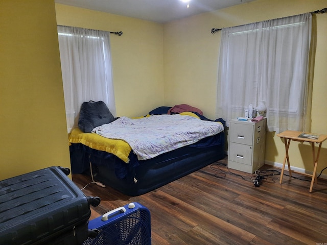 bedroom with wood finished floors