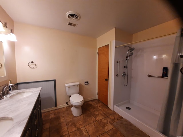 full bath with double vanity, visible vents, toilet, a sink, and walk in shower