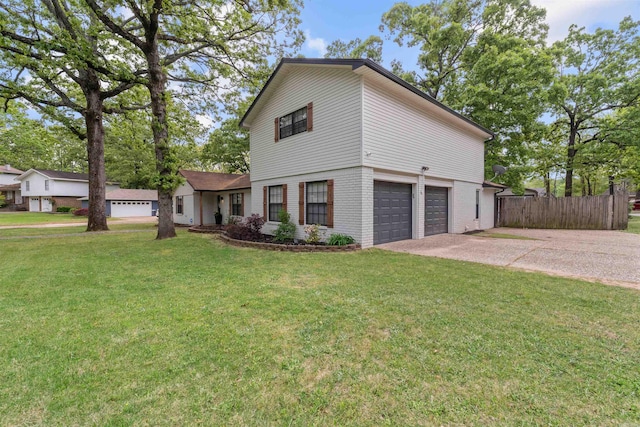 view of front of home with concrete driveway, a front lawn, fence, a garage, and brick siding