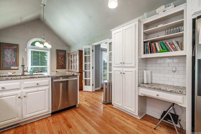 kitchen featuring a sink, decorative backsplash, dishwasher, light wood-style flooring, and white cabinetry