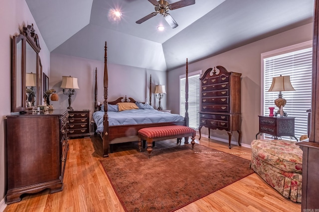 bedroom with light wood finished floors, a ceiling fan, and lofted ceiling