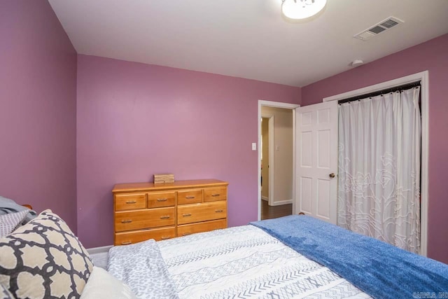 bedroom with visible vents and baseboards