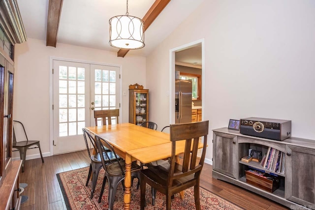 dining area with beamed ceiling, plenty of natural light, french doors, and wood finished floors