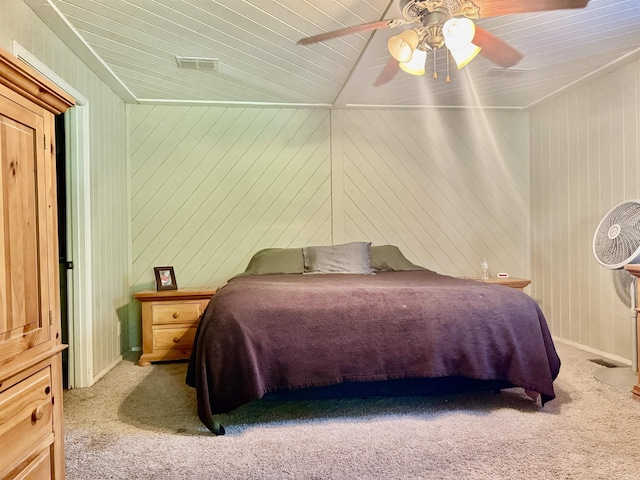 bedroom featuring lofted ceiling, a ceiling fan, carpet flooring, and wooden ceiling