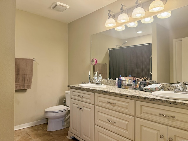 full bath with a sink, a shower with shower curtain, double vanity, and toilet