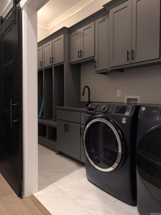 157 Manitou Dr, Maumelle, AR 72113 - laundry area with cabinet space, washing machine and clothes dryer, and a sink