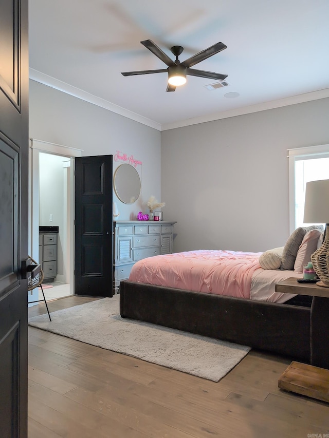 157 Manitou Dr, Maumelle, AR 72113 - bedroom featuring a ceiling fan, ornamental molding, visible vents, and light wood-style flooring