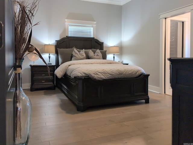 157 Manitou Dr, Maumelle, AR 72113 - bedroom featuring light wood finished floors and baseboards