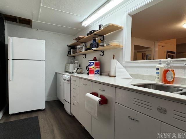 107 N Marr St, Pocahontas, AR 72455 - kitchen with white cabinets, dark wood-style flooring, white appliances, open shelves, and light countertops