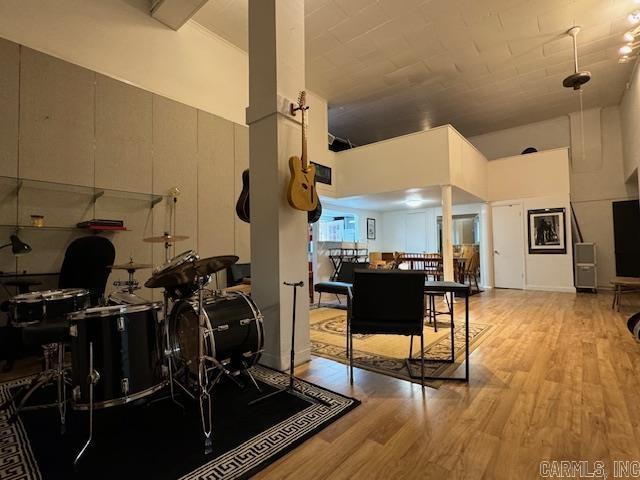 107 N Marr St, Pocahontas, AR 72455 - interior space with wood finished floors and a towering ceiling