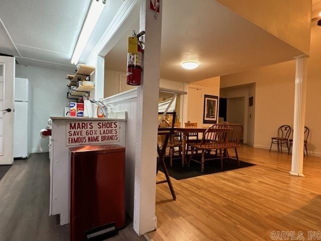 107 N Marr St, Pocahontas, AR 72455 - interior space with wood finished floors and freestanding refrigerator