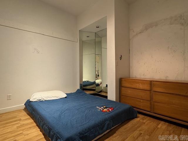 107 N Marr St, Pocahontas, AR 72455 - bedroom featuring baseboards and wood finished floors