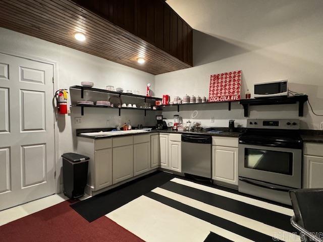 107 N Marr St, Pocahontas, AR 72455 - kitchen featuring open shelves, stainless steel appliances, and dark countertops