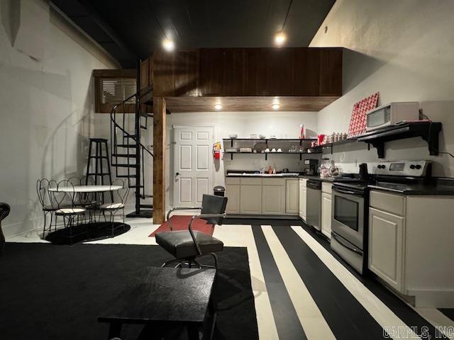 107 N Marr St, Pocahontas, AR 72455 - kitchen with dark countertops, open shelves, and stainless steel appliances