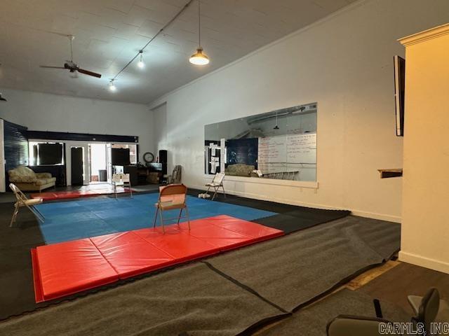 107 N Marr St, Pocahontas, AR 72455 - interior space featuring track lighting, a ceiling fan, and baseboards