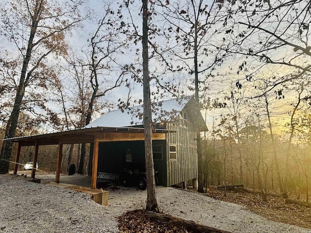 view of home's exterior featuring a carport and metal roof