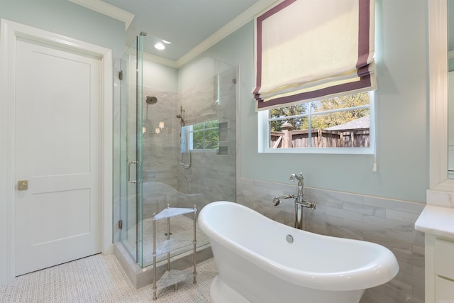 full bathroom featuring a shower stall, a freestanding bath, tile patterned floors, and tile walls