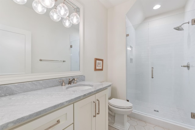 full bath featuring a shower stall, toilet, vanity, and tile patterned floors