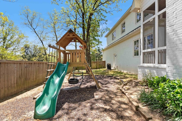 view of playground featuring a fenced backyard