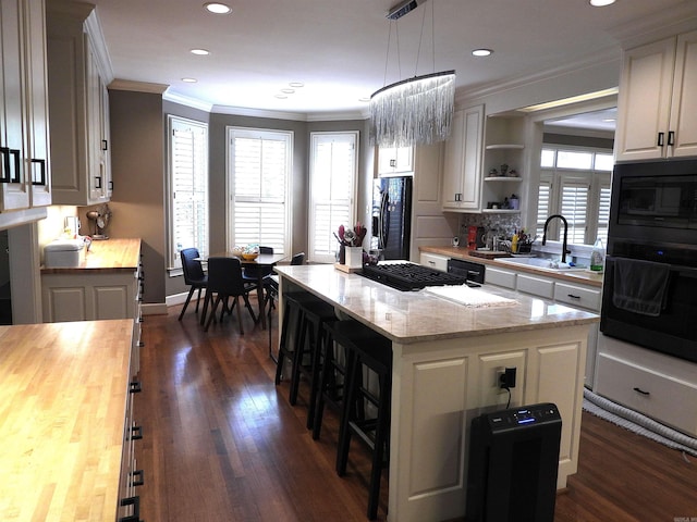 22 Talais Dr, Little Rock, AR 72223 - kitchen featuring a sink, black appliances, open shelves, butcher block counters, and ornamental molding